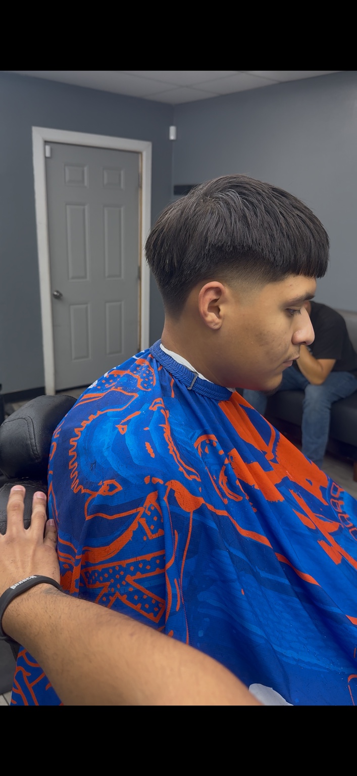Recent textured haircut with a close side fade at 4th St Barber Room